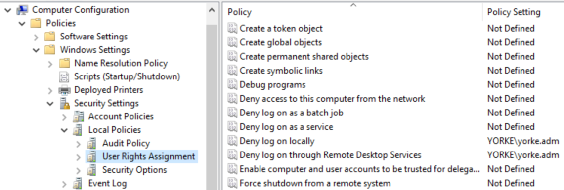 Local Group Policy Editor showing User Rights Assignment, with the Deny log on locally and Deny log on through Remote Desktop Services policies both set to include the service account.