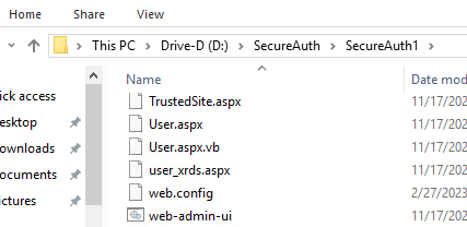 Windows File Explorer showing a realm folder's contents, including TrustedSite.aspx, User.aspx, User.aspx.vb, user_xrds.aspx, web.config, and web-admin-ui.